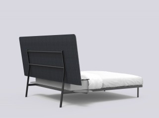 a bed that has been designed to look good from the back too so it could be placed in the middle of a room.