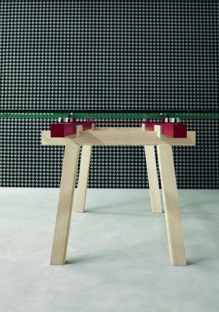 as if the table was just a layering of different and separate elements in different materials.