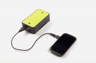 the "Turtle" add-on charging a phone.