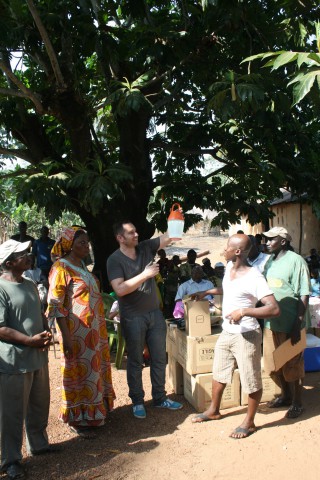 explaining the logic of the lamp to the villagers.