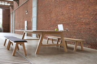 a versatile table that can either serve as a common eating table, a gathering point for group interactions, a temporary working space, or just as a workbench.